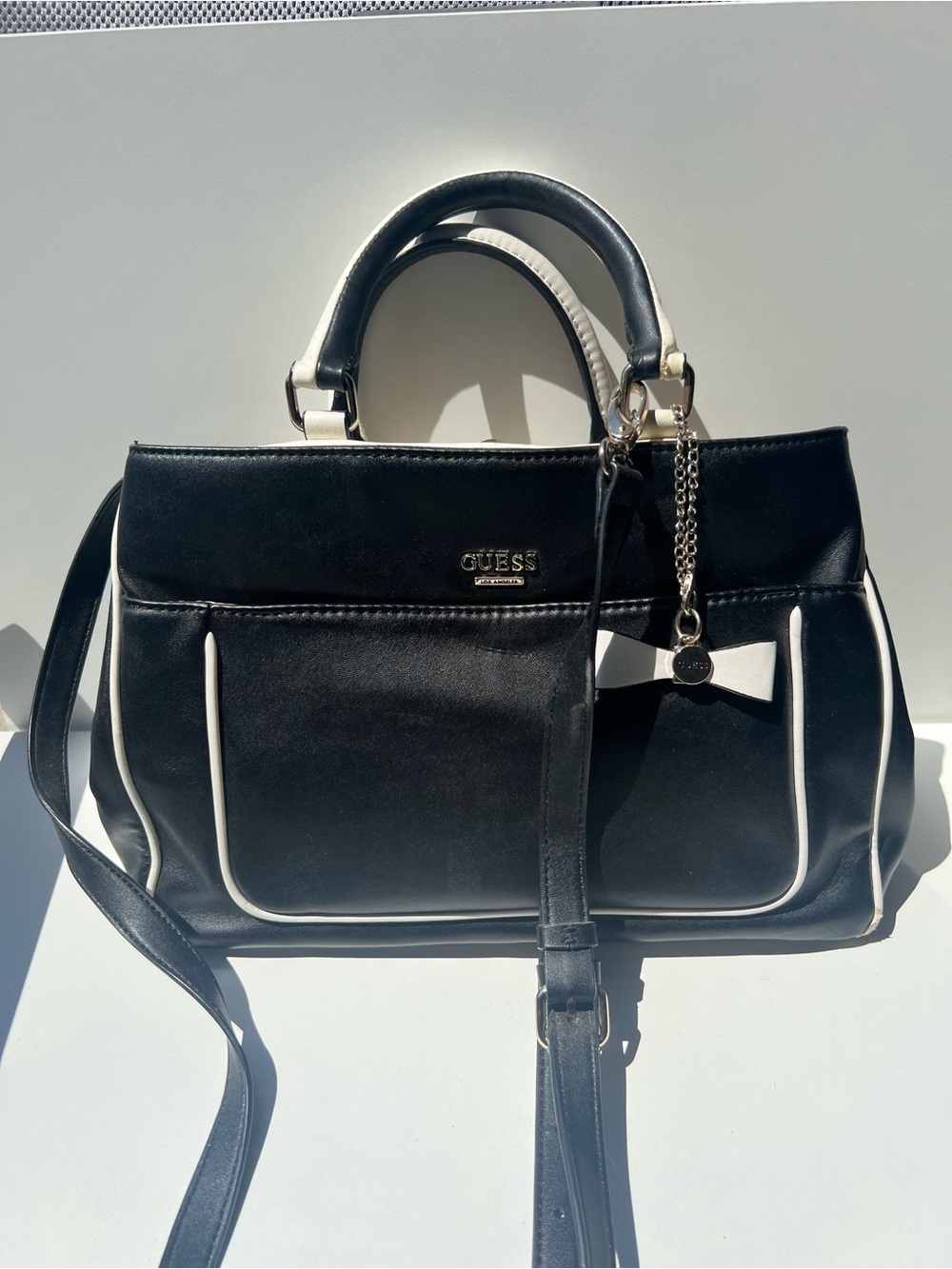 GUESS Black Satchel with White Trim and Bow Charm